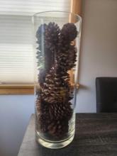 20" tall clear glass vase and pinecones
