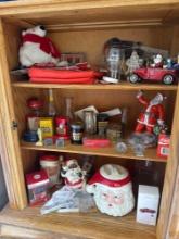assorted Coke, memorabilia and collectibles inside oak cabinet