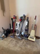 several Dyson vacuums and Hoover vacuum