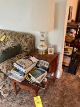 end table with lamp, magazines, novels