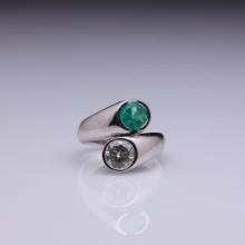 18k White Gold Moissanite & Emerald Crossover Ring by Carlo Rici