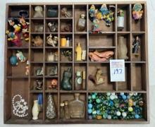 Wood shelf with contents - smurfs and Mickey Mouse, small bottles, marbles
