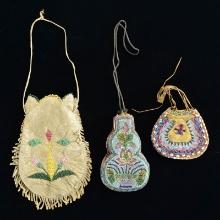 THREE NATIVE AMERICAN BEAD DECORATED POUCHES.