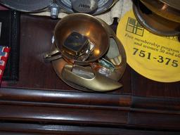 Brass teacup and contents