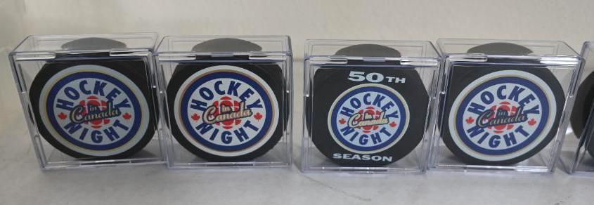 Seven Collector Hockey Pucks