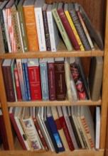 Three Shelves Filled with Books on Law, Food, Native American Tribes, and More