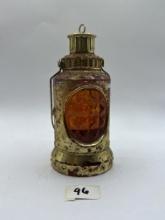 caseys lantern with some liquid avon bottle