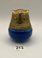 Blue and gold owl with some liquid Avon bottle