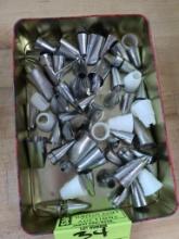 container of assorted cake decorating nozzles