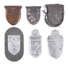 LOT OF 6: GERMAN WWII CAMPAIGN SHIELDS.