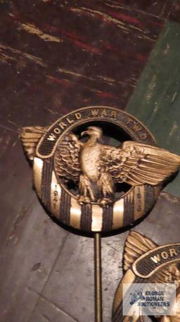 Two World War II brass markers