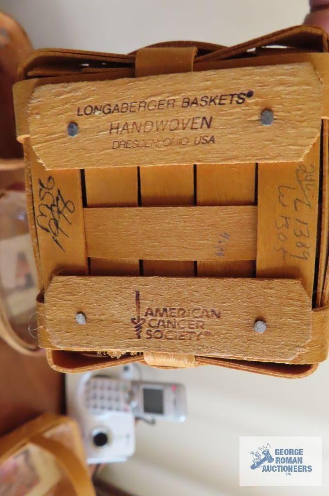Three Longaberger baskets and two candle holders
