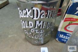 lot of canning jars and lids and Jack Daniels gold medal decanter