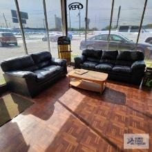 Faux leather sofa, love seat, oak finish coffee table and decorative armchair