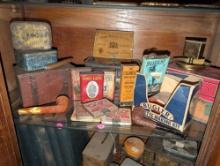 (LR) SHELF LOT OF VINTAGE COLLECTIBLE TOBACCO ITEMS TO INCLUDE AN ASSORTMENT OF TOBACCO TINS, (2)