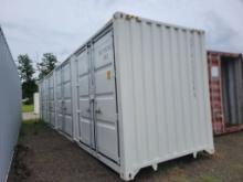 UNUSED 2024 SHIPPING CONTAINER WITH (4) 7' BAY DOORS, FORK LIFT POCKETS, SN
