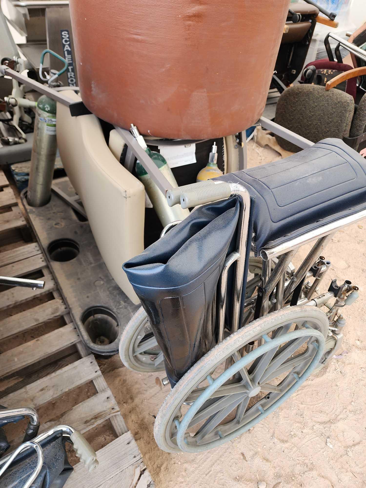 (1) Scale Tronix, (1) Wheel Chair, (2) Cushion Chairs, (4) Medical Oxygen Tanks, Misc.