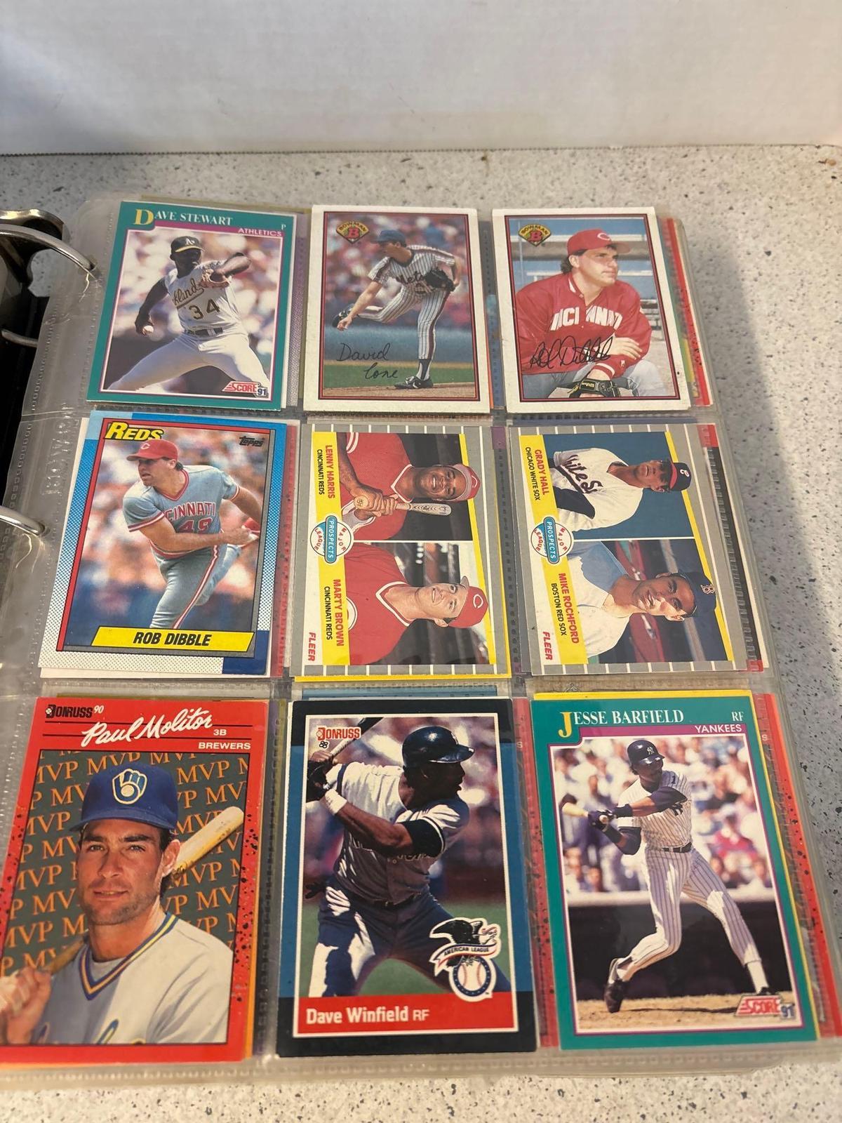 three ring binder full of baseball cards