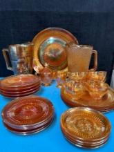 29 pieces of iridescent, carnival glass, including 2 pitchers