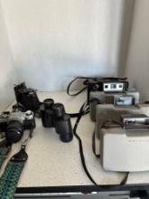 Nikon Binoculars Polaroid cameras canon cam Kodak camera