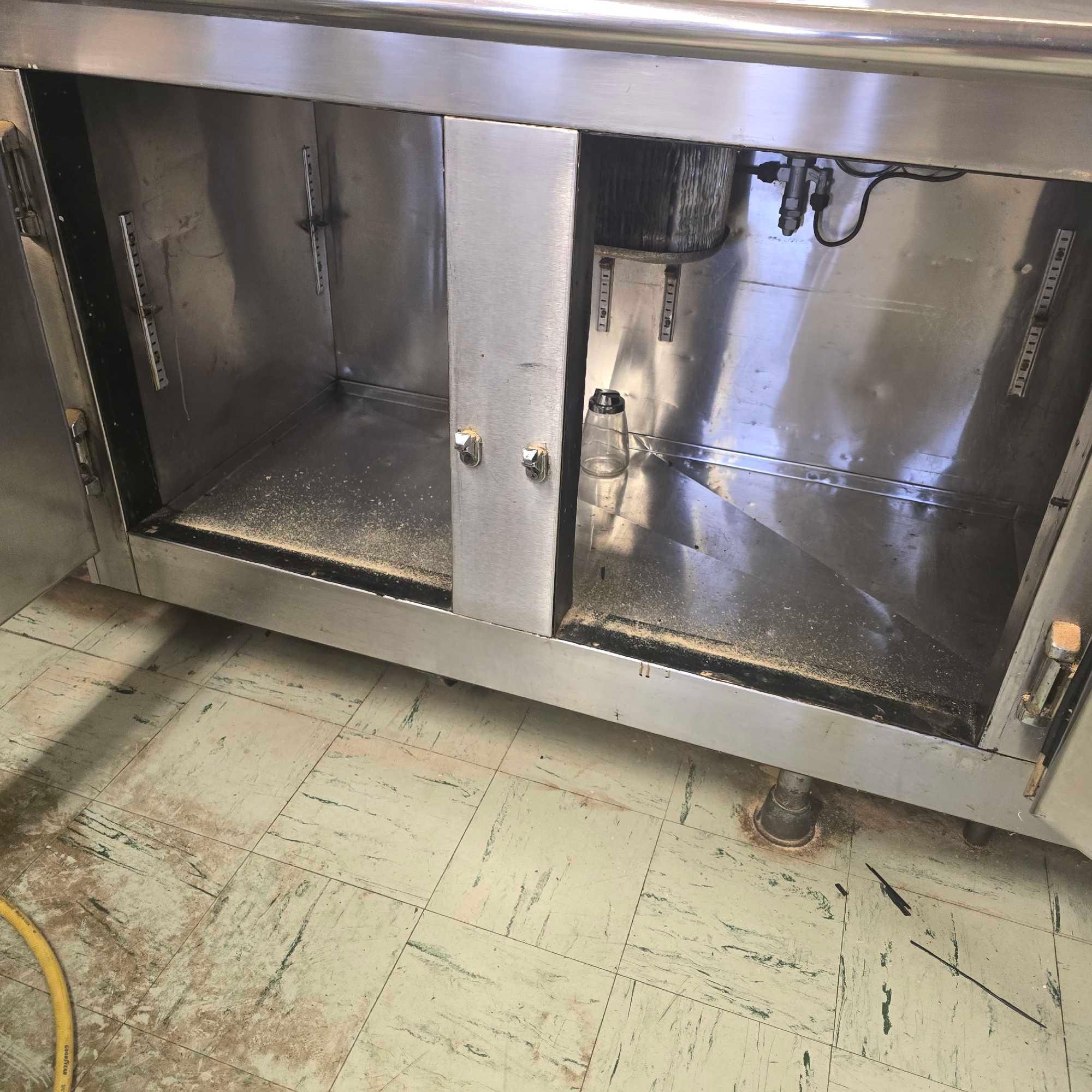 large stainless Steel counter with sink and outlets